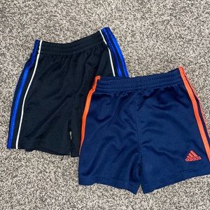 2 pairs of adidas basketball shorts.